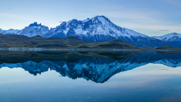 Snow Covered Mountain Near Body Of