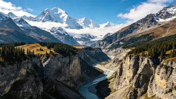 N the deep valley a river rushes along and distant peaks cap
